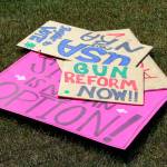 Signs are stacked on the ground during a demonstration opposing gun violence on Saturday, June 11, 2022, in Soldotna, Alaska. The local protest was part of a nationwide call to action issued by the nonprofit organization March for Our Lives, which was formed after a 2018 school shooting in Parkland, Florida, and aims to end gun violence. (Ashlyn OHara/Peninsula Clarion)