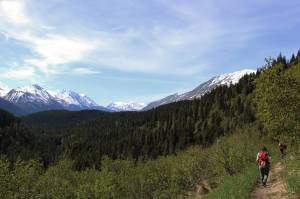 Hikers walk along the Ptarmigan Lake trail on Sunday, May 22, 2022 near Seward, Alaska. (Ashlyn OHara/Peninsula Clarion)