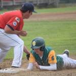 Services James Ivey dives under the tag of Post 20 first baseman Riley Johnson on Saturday, June 18, 2022, at Coral Seymour Memorial Park in Kenai, Alaska. (Photo by Jeff Helminiak/Peninsula Clarion)