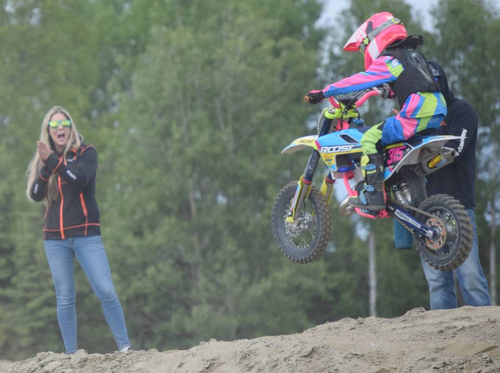 Kayla Lindley of Soldotna cheers on her son, Karbon, at Alaska State Motocross Race 3 on Saturday, June 18, 2022, at Twin City Raceway in Kenai, Alaska. (Photo by Jeff Helminiak/Peninsula Clarion)