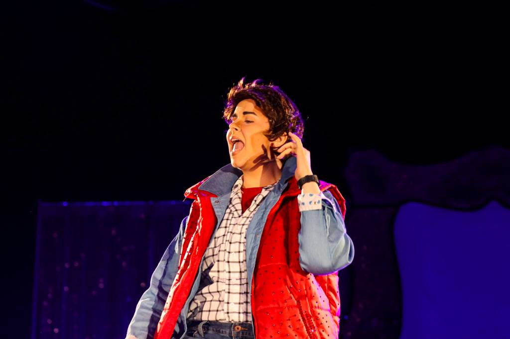 Dear Evan Handsome, a local drag performer, launches in his set at Glitz, a major annual drag event celebrated every Pride Month, at Centennial Hall on June 18, 2022. (Michael S. Lockett / Juneau Empire)