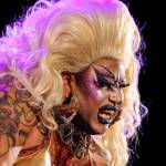 Frankie Doom, one of the headlining performers, bares teeth at the crowd during Glitz, a major annual drag event celebrated every Pride Month, at Centennial Hall on June 18, 2022. (Michael S. Lockett / Juneau Empire)