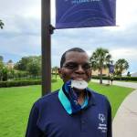 Darryl Magen takes a bite out of his silver medal at the 2022 Special Olympics USA Games in Orlando, Florida, on June 10, 2022. Magen earned silver in the 50-yard freestyle and gold in the 100-yard freestyle swimming competitions.