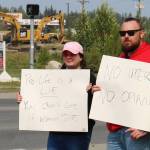 Megan Mitchell, left, and Nick McCoy protest the U.S. Supreme Courts decision overturning of Roe v. Wade at the intersection of the Kenai Spur and Sterling highways on Friday, June 24, 2022 in Soldotna, Alaska. (Ashlyn OHara/Peninsula Clarion)