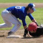 Shunsuke Sakaino of the Oilers dives under the tag of Anchorage Glacier Pilots first baseman Logan Gallina on Sunday, June 26, 2022, at Coral Seymour Memorial Park in Kenai, Alaska. (Photo by Jeff Helminiak/Peninsula Clarion)