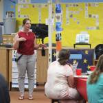 KPBSD Summer Work Program Coordinator Olivia Orth welcomes guests to a program celebration in the Soldotna High School Library on Tuesday, June 28, 2022, in Soldotna, Alaska. (Ashlyn OHara/Peninsula Clarion)