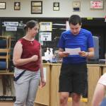 KPBSD Summer Work Program Coordinator Olivia Orth, left, assists Robert Nelson with a presentation in the Soldotna High School Library on Tuesday, June 28, 2022, in Soldotna, Alaska. (Ashlyn OHara/Peninsula Clarion)
