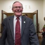 In this April 11, 2018 photo state Sen. Dennis Egan, D-Juneau, walks out of the Senate chambers and to a reception to honor him and Sen. Berta Gardner, D-Anchorage, at the Capitol. Both were retiring from the legislature. (Michael Penn / Juneau Empire File)