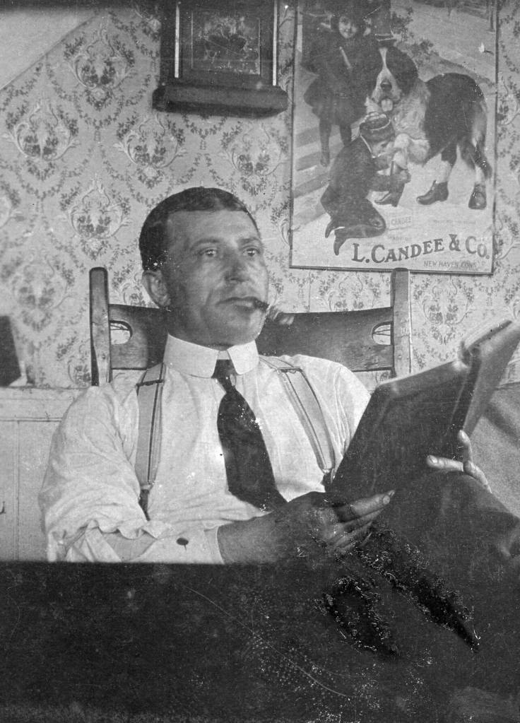 Photo courtesy of the Viani Family Collection 
P.F. Frenchy Vian poses with a cigar and some reading material, probably circa 1920, in an unspecified location.