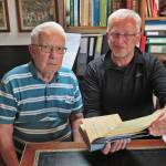 Photo by Yvonne Leutwyler
Rinantonio Viani, left, and Clark Fair pose in Rinos home office  in Lausanne, Switzerland  as they discuss the writing and documentation of the story Pietro Francesco Frenchy Viani.