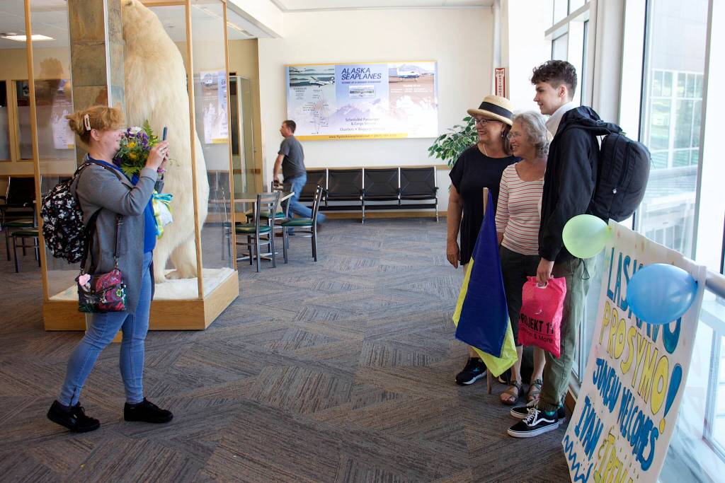 Mark Sabbatini / Juneau Empire
Iryna Hrynchenko takes a photo of Bridget Smith, Joyanne Bloom and Hrynchenkos 18-year-old son Ivan inside Juneau International Airport on Saturday, June 25, 2022.