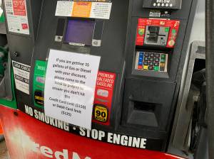 Signs warn Fred Meyer customers to prepay if they thing they may go over limits while pumping gas on Friday, March 11, 2022 in Soldotna, Alaska. (Ashlyn OHara/Peninsula Clarion)