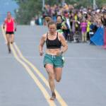 Sewards Hannah Lafleur leads a trail of runners to the finish to take second in the womens Mount Marathon Race on Monday, July 4, 2022, in Seward, Alaska. (Photo by Jeff Helminiak/Peninsula Clarion)