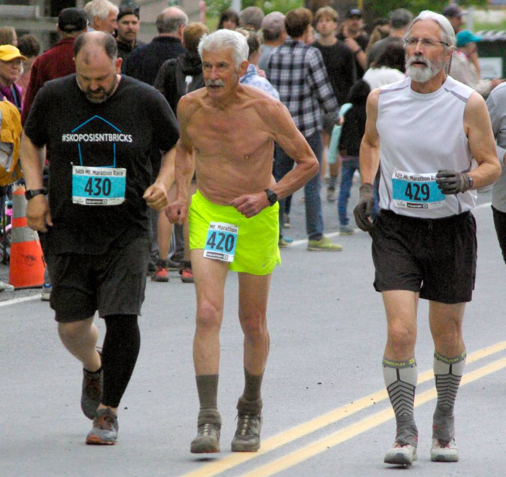 Sewards Fred Moore (420) finishes his record 52nd mens Mount Marathon Race on Monday, July 4, 2022, in Seward, Alaska. (Photo by Jeff Helminiak/Peninsula Clarion)
