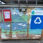Recycling signage is displayed on an upscaled dumpster used to collect plastics as part of a project to turn discarded plastic waste into artificial lumber, in Seward, Alaska. (Photo courtesy Lori Landstrom)