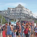 A giant silver salmon is paraded through Salmonfest on Saturday, Aug. 3, 2019, in Ninilchik, Alaska. (Photo by Megan Pacer/Homer News)