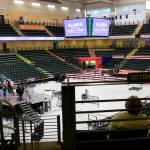 Mark Sabbatini / Juneau Empire
A couple of visitors watch preparations Friday afternoon for the Save America Rally scheduled Saturday at the Alaska Airlines Center in Anchorage.