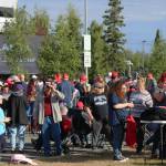 People gather outside of the Alaska Airlines Center, where a Save America rally was being held, on Saturday, July 9, 2022, in Anchorage, Alaska. Former President Donald Trump, U.S. Senate candidate Kelly Tshibaka and U.S. House candidate Sarah Palin were among the events speakers. (Ashlyn OHara/Peninsula Clarion)