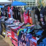Save America rally attendees shop for merchandise outside of the Alaska Airlines Center on Saturday, July 9, 2022, in Anchorage, Alaska. Former President Donald Trump, U.S. Senate candidate Kelly Tshibaka and U.S. House candidate Sarah Palin were among the events speakers. (Ashlyn OHara/Peninsula Clarion)