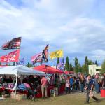 Vendors sell flags and other merchandise outside of the Alaska Airlines Center, where a Save America rally was being held, on Saturday, July 9, 2022, in Anchorage, Alaska. Former President Donald Trump, U.S. Senate candidate Kelly Tshibaka and U.S. House candidate Sarah Palin were among the events speakers. (Ashlyn OHara/Peninsula Clarion)