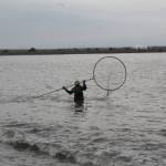 A dipnetter fishes at North Kenai Beach on Tuesday, July 12, 2022. (Camille Botello/Peninsula Clarion)