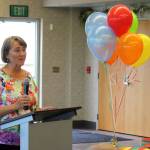 Vicke Kukowski speaks during a ceremony dedicating the Kenai Senior Centers greenhouse to her dad, Bill Osborn, on Tuesday, July 12, 2022 in Kenai, Alaska. (Ashlyn OHara/Peninsula Clarion)
