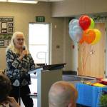 Rachael Craig shares memories of Bill Osborn during a greenhouse dedication ceremony on Tuesday, July 12, 2022 in Kenai, Alaska. (Ashlyn OHara/Peninsula Clarion)