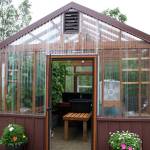 Plants grow inside of a greenhouse dedicated to Bill Osborn on Tuesday, July 12, 2022 in Kenai, Alaska. (Ashlyn OHara/Peninsula Clarion)