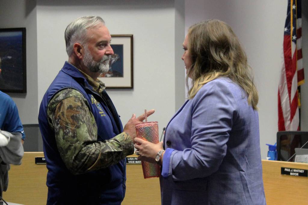 Rep. Ron Gillham (left) speaks to Soldotna City Manager Stephanie Queen (right) at a Soldotna City Council meeting on Wednesday, July 13, 2022, in Soldotna, Alaska. (Ashlyn OHara/Peninsula Clarion)