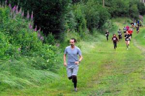 Competitors start the Unity Run on Saturday, July 16, 2022, at Tsalteshi Trails just outside of Soldotna, Alaska. (Photo by Jeff Helminak/Peninsula Clarion)