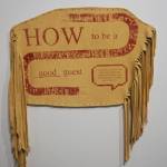 Melissa Shaginoffs How to be a Good Guest is part of Protection: Adaptation and Resistance, on exhibit at the Pratt Museum & Park in Homer, Alaska, through Sept. 24, 2022. The screen print on hide work accompanies a pamphlet she created for a residency abroad that frames introductions in Indigenous protocols. (Photo by Michael Armstrong/Homer News)