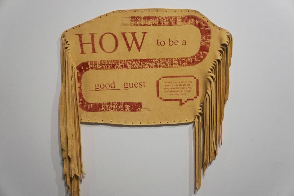 Melissa Shaginoffs How to be a Good Guest is part of Protection: Adaptation and Resistance, on exhibit at the Pratt Museum & Park in Homer, Alaska, through Sept. 24, 2022. The screen print on hide work accompanies a pamphlet she created for a residency abroad that frames introductions in Indigenous protocols. (Photo by Michael Armstrong/Homer News)