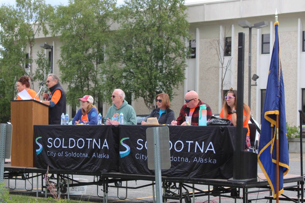 Panelists judge floats in the 65th annual Soldotna Progress Days Parade on Saturday, July 23, 2022, in Soldotna, Alaska. (Ashlyn OHara/Peninsula Clarion)