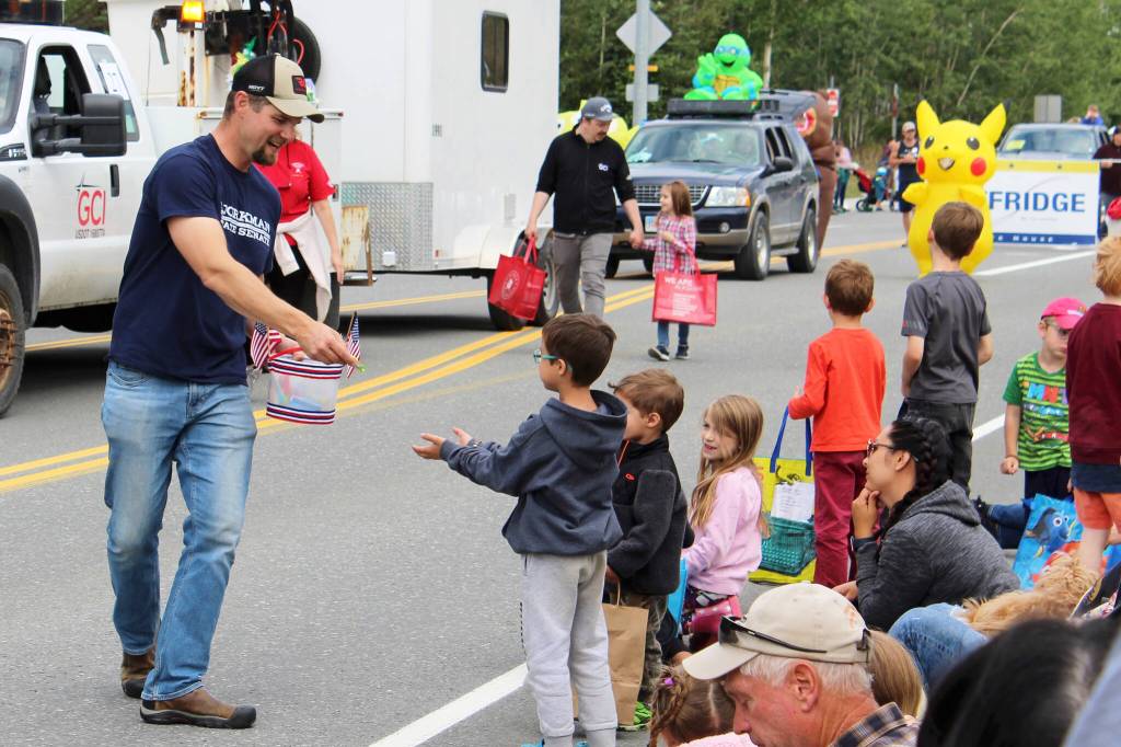 2022 Alaska State Senate candidate Jesse Bjorkman hands out candy during the 65th annual Soldotna Progress Days Parade on Saturday, July 23, 2022, in Soldotna, Alaska. (Ashlyn OHara/Peninsula Clarion)