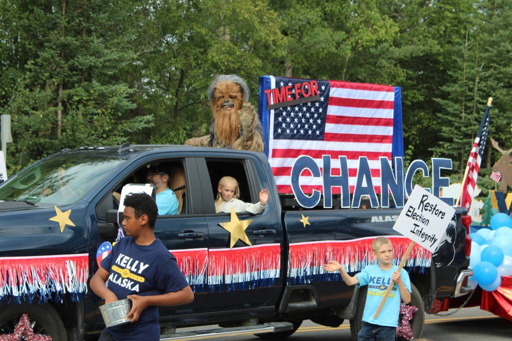 Supporters of 2022 U.S. Senate candidate Kelly Tshibaka walk in the 65th annual Soldotna Progress Days Parade on Saturday, July 23, 2022, in Soldotna, Alaska. (Ashlyn OHara/Peninsula Clarion)