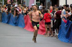 Seward's Erik Johnson finishes the men's Mount Marathon Race in Seward, Alaska, on Monday, July 4, 2022. (Photo by Jeff Helminiak/Peninsula Clarion)
