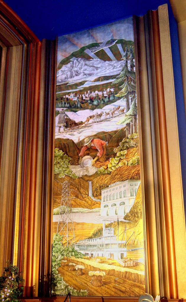 One of the gold- and silver-leaf murals of Alaska wildlife, industries and Mount McKinley hangs in the main room of the 4th Avenue Theatre in Anchorage, Alaska, on March 29, 2006. Demolition will begin in August 2022 on a once-opulent downtown Anchorage movie theater designed by the architect of Hollywoods famed Pantages Theater. The 4th Avenue Theatre with nearly 1,000 seats opened in 1947, and it withstood the second most powerful earthquake ever recorded. (AP Photo/Al Grillo, File)