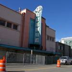 Fencing surrounds the 4th Avenue Theatre in Anchorage, Alaska, on Wednesday, Aug. 3, 2022. Demolition will begin in August 2022 on the once-opulent downtown Anchorage movie theater designed by the architect of Hollywoods famed Pantages Theatre. The 4th Avenue Theatre with nearly 1,000 seats opened in 1947, and it withstood the second most powerful earthquake ever recorded. (AP Photo/Mark Thiessen)