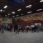 Attendees look on the arena where animals are being shown at the 4-H Agriculture Expo in Soldotna, Alaska, on Aug. 5, 2022. (Jake Dye/Peninsula Clarion)