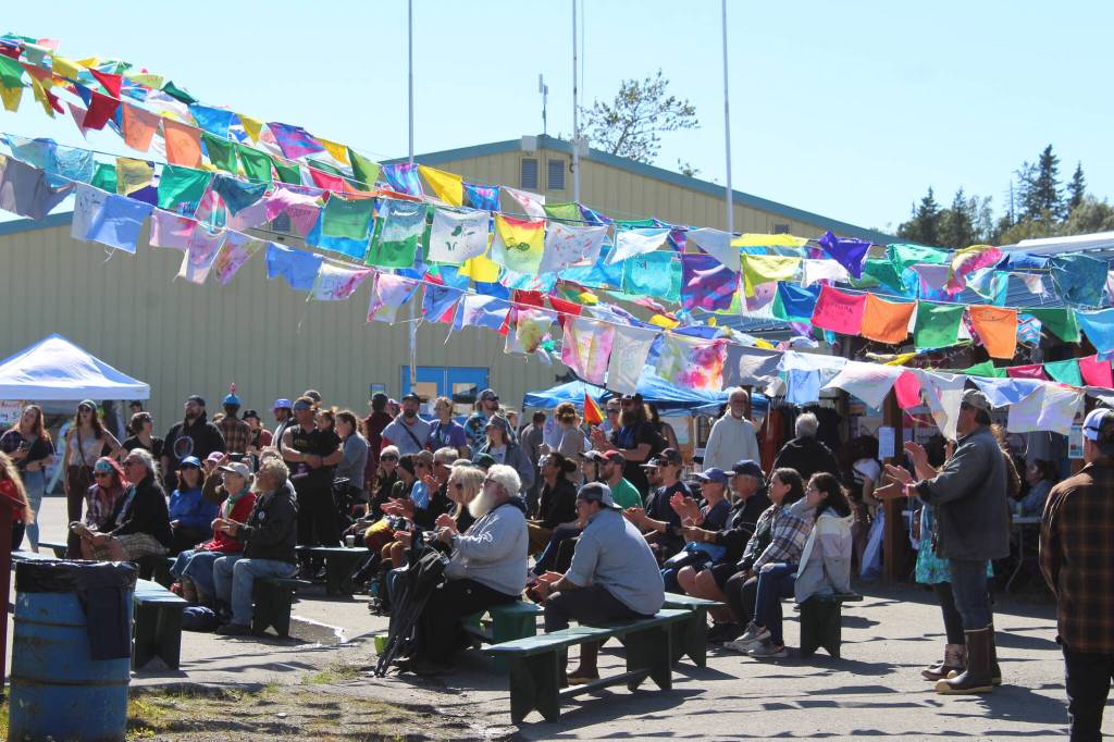 People gather in Ninilchik, Alaska, on Friday, Aug. 5, 2022, for Salmonfest, an annual event that raises awareness about salmon-related causes. (Ashlyn OHara/Peninsula Clarion)