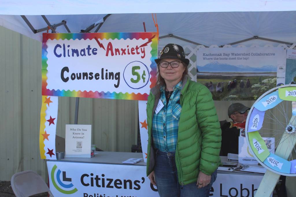 Sarah McCabe, of the Anchorage chapter of the Citizens Climate Lobby, speaks about climate change at Salmonfest in Ninilchik, Alaska, on Friday, Aug. 5, 2022. (Ashlyn OHara/Peninsula Clarion)