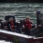 Children ride a fishing boat onto the Kenai River during the Kenai River Junior Classic in Soldotna, Alaska, on Aug. 10, 2022. (Jake Dye/Peninsula Clarion)