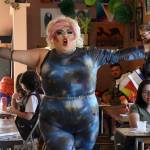 This July 28, 2022, photo shows drag queen Dela Rosa performing in a mock election at Cafecito Bonito in Anchorage, Alaska, where people ranked the performances by drag performers. Several organizations are using different methods to teach Alaskans about ranked choice voting, which will be used in the upcoming special U.S. House election. (AP Photo/Mark Thiessen)