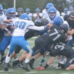 Homers defensive unit registers a sack against Kodiak on Saturday, Aug. 13, 2022, at Homer High School in Homer, Alaska. (Photo by Charlie Menke/ Homer News)