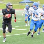 Homers Jake Tappan rushes against Kodiak on Saturday, Aug. 13, 2022, at Homer High School in Homer, Alaska. (Photo by Charlie Menke/Homer News)