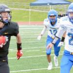Homer's Jake Tappan rushes against Kodiak on Saturday, Aug. 13, 2022, at Homer High School in Homer, Alaska. (Photo by Charlie Menke/Homer News)