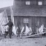 William N. (Bill) Dawson poses in either Kenai or Kasilof in 1898 with a collection of moose antlers and sheep horns  trophies from kills he had made in the Skilak Lake area. (Photo from J.T. Studleys 1912 hunting memoir)