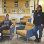 photos by Jake Dye / Peninsula Clarion 
Alex LeClair, Kenai Peninsula College enrollment specialist, and Natasha Sison, financial aid specialist with the KPC Financial Aid Office, are seen in the Kenai Peninsula College Student Services Office on Thursday near Soldotna.