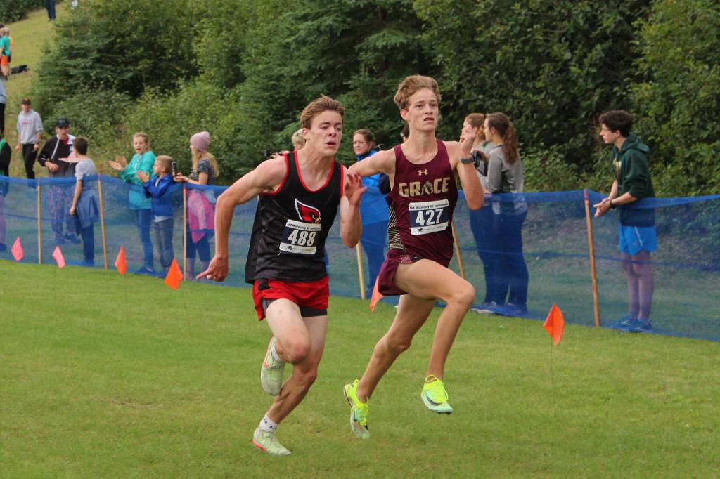 Kenai Central High Schools Gregory Fallon and Grace Christian Schools Robbie Annett run toward the finish line at the 2022 Ted McKenney XC Running Invitational at Skyview Middle School on Saturday, Aug. 20, 2022 in Soldotna, Alaska. (Ashlyn OHara/Peninsula Clarion)