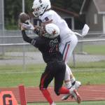 Kenai Centrals Owen Whicker breaks up a pass intended for North Poles Gabe Hollett on Saturday, Aug. 20, 2022, at Ed Hollier Field at Kenai Central High School in Kenai, Alaska. (Photo by Jeff Helminiak/Peninsula Clarion)